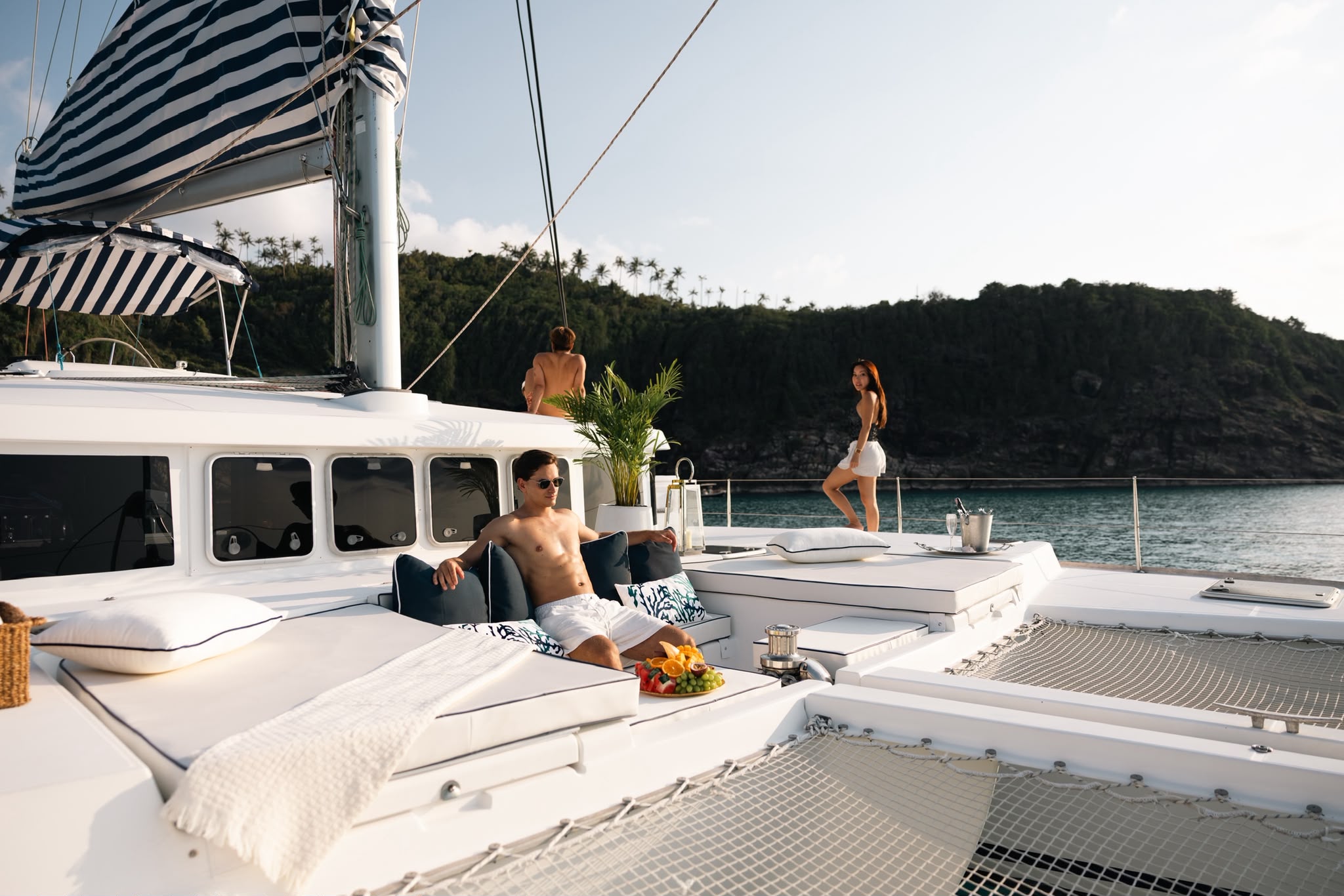 A crewed catamaran in the late afternoon sun off Koh Samui