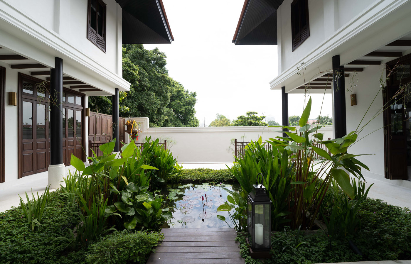 The lotus pond courtyard between the houses at Siri Sala