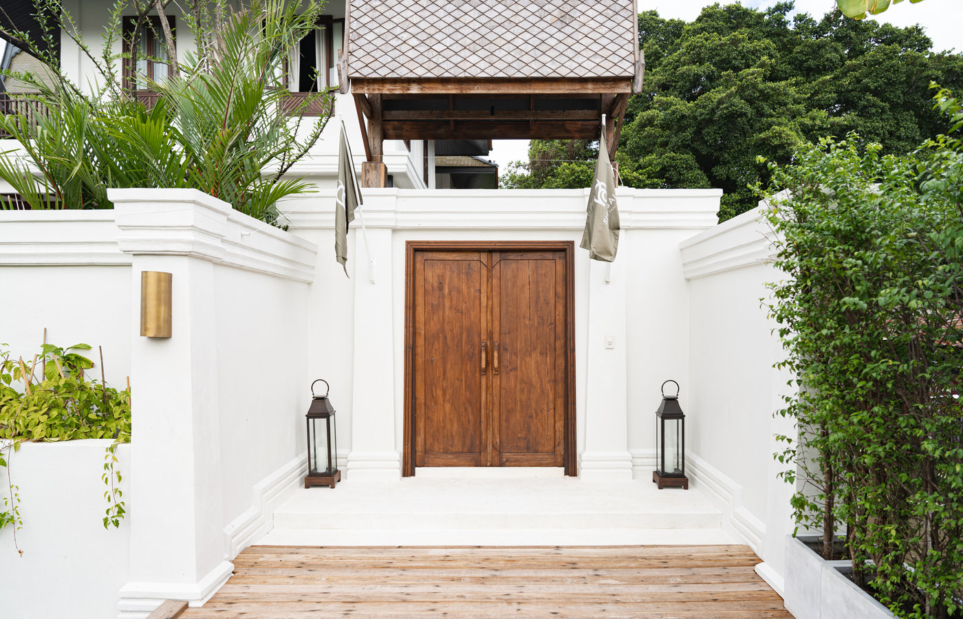 The entrance door of Siri Sala reached along a lotus-lined walkway
